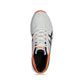White running shoe with orange accents on a white background