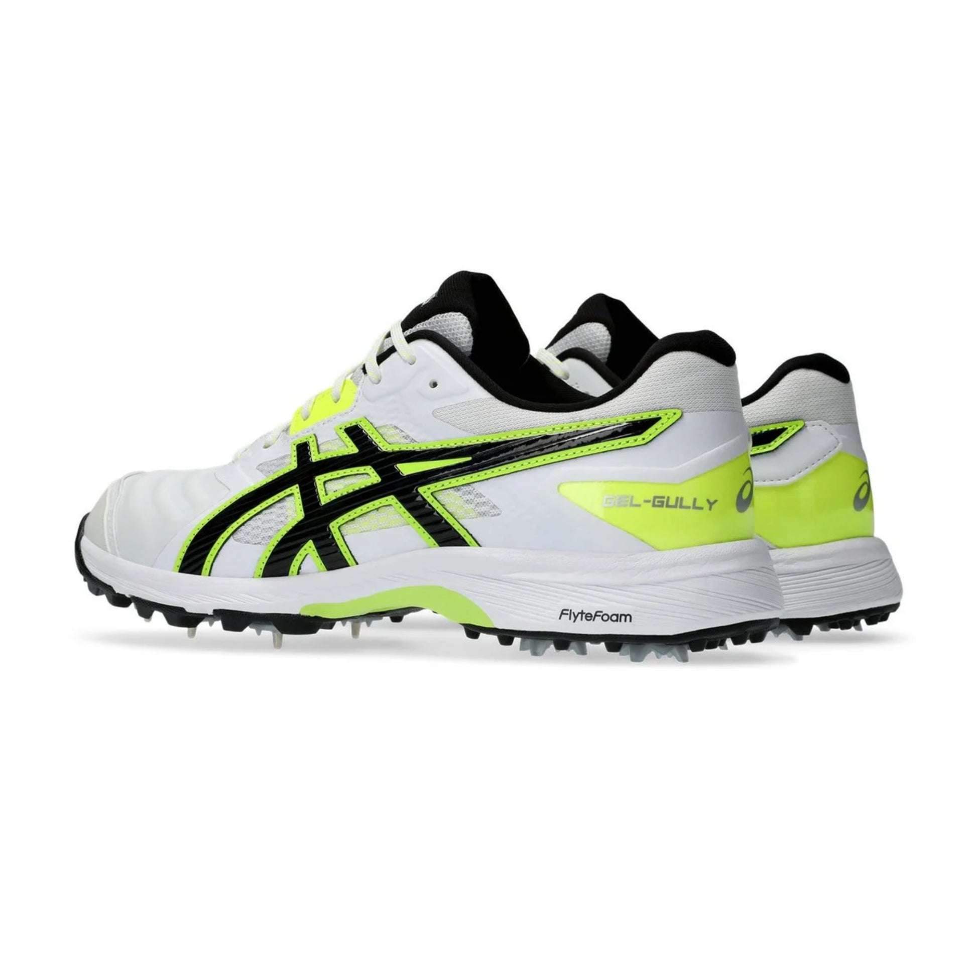 White and black sports shoes with green accents on a white background.
