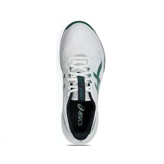 White sneaker with green accents on a white background