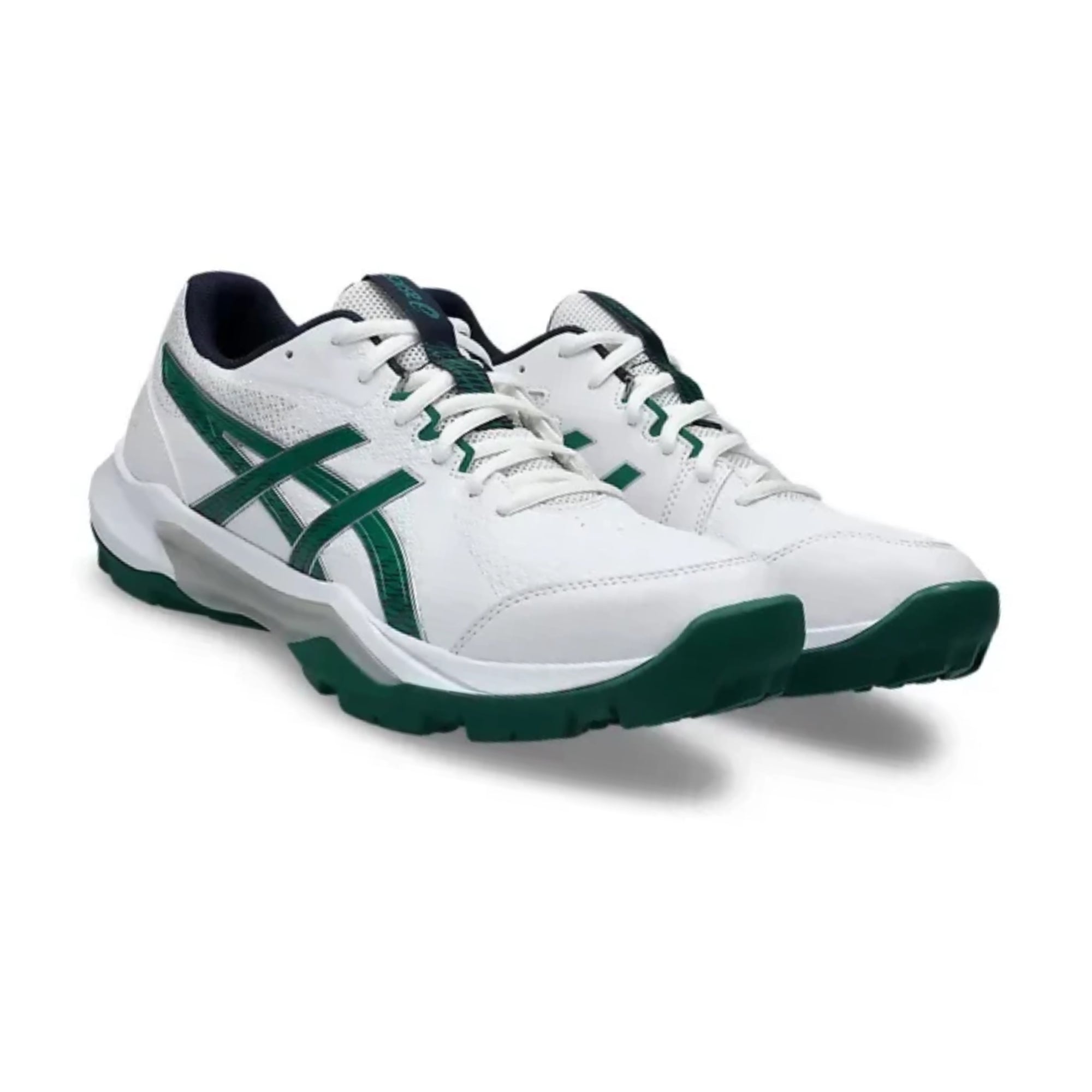 White sneakers with green accents on a white background