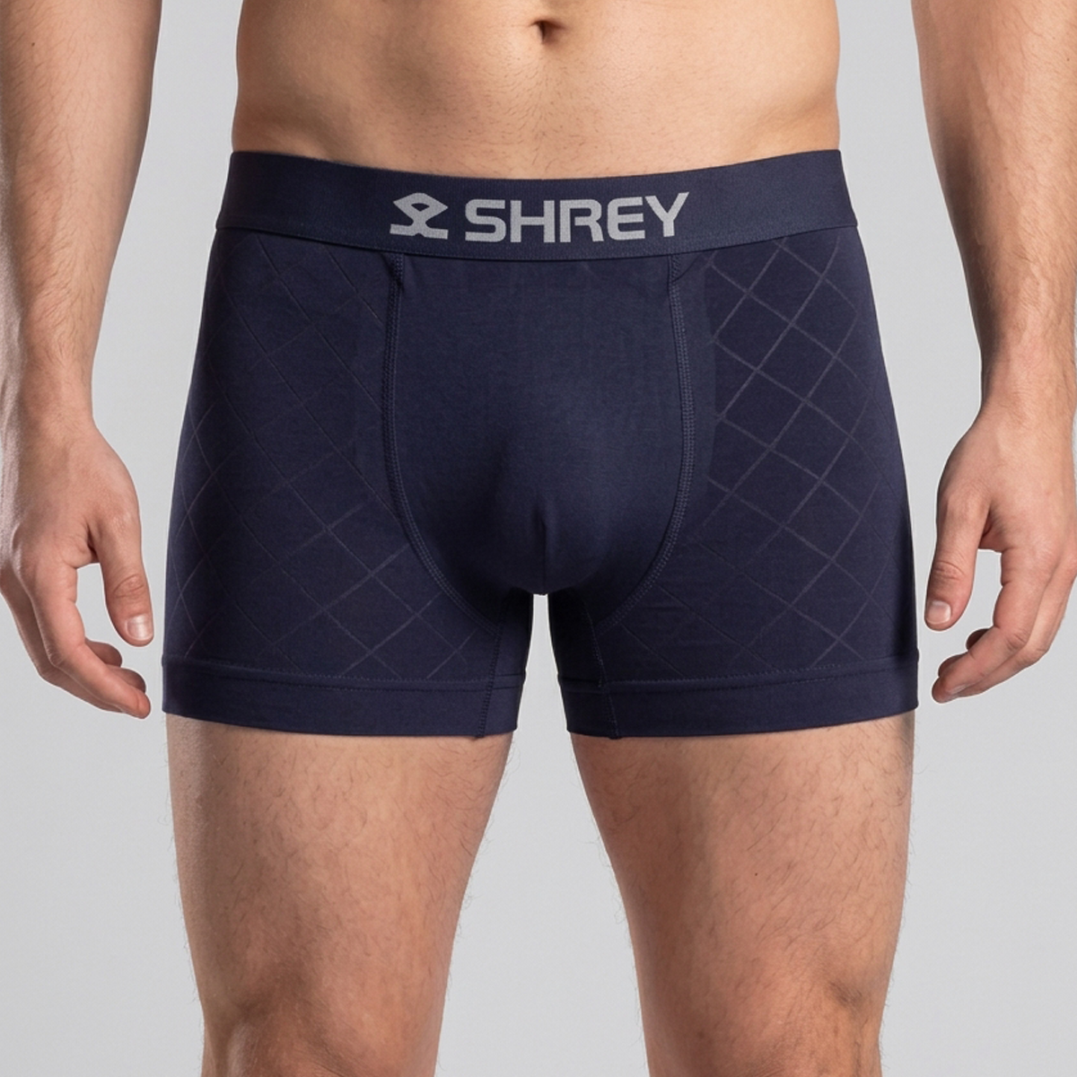 Model wearing Shrey athletic boxer briefs in navy, rear view, available in Pakistan