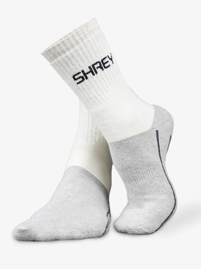 White and gray socks with 'SHREY' branding on a white background