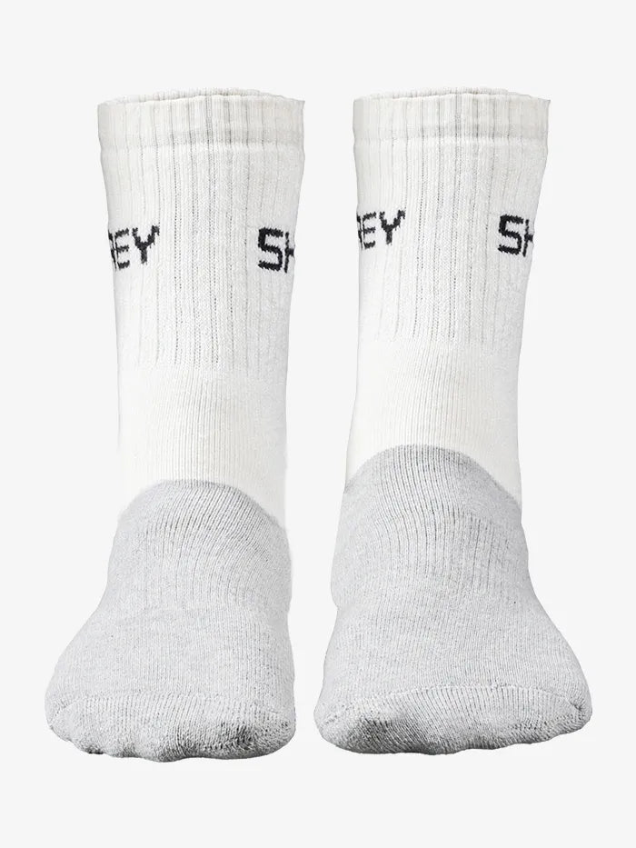 Two white socks with black text on a white background